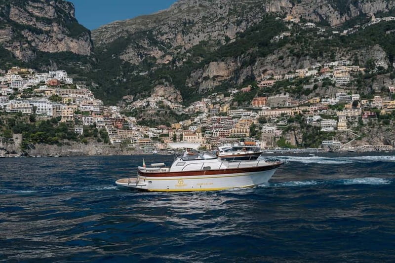 Positano: Amalfi Coast & Emerald Grotto Private Boat Tour - Leaving Positano and reading the coast from the sea
