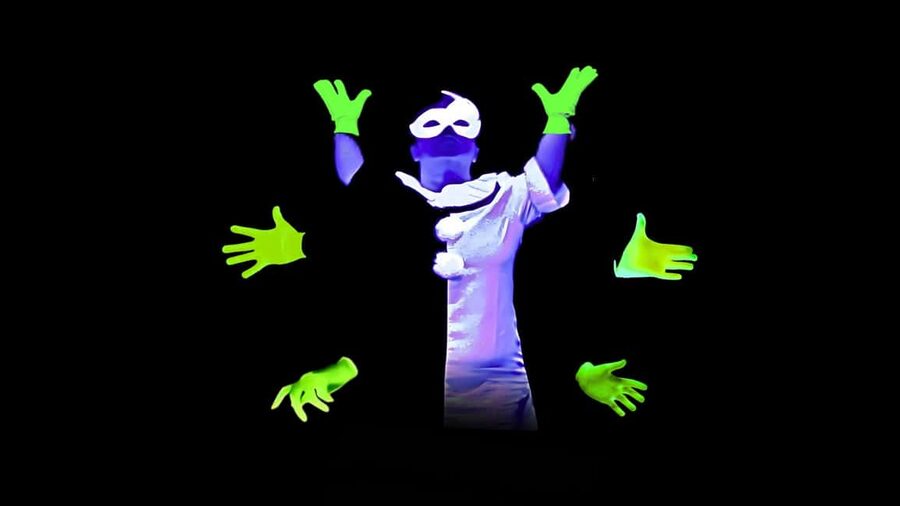 Prague: Underground Black Light Theatre Interactive Show - The opening film explains the black light trick