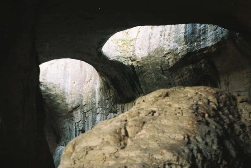 Prohodna, Saeva Dupka Cave and Glozhene Tour from Sofia - Walking into Prohodna Cave near Karlukovo