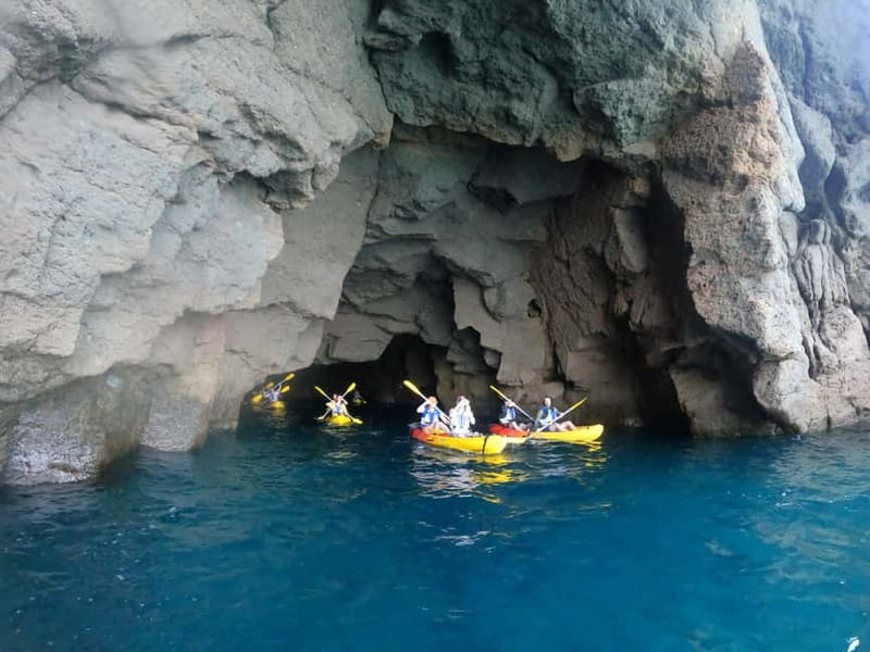 Puerto Mogán: Guided Adventure Kayak Tour in Caves & Snorkel - Paddling beneath the volcanic cliffs