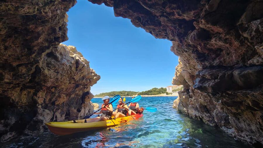 Pula: Cave Kayak Tour, Snorkeling and Island Jumping - Getting started at Ambrela Beach
