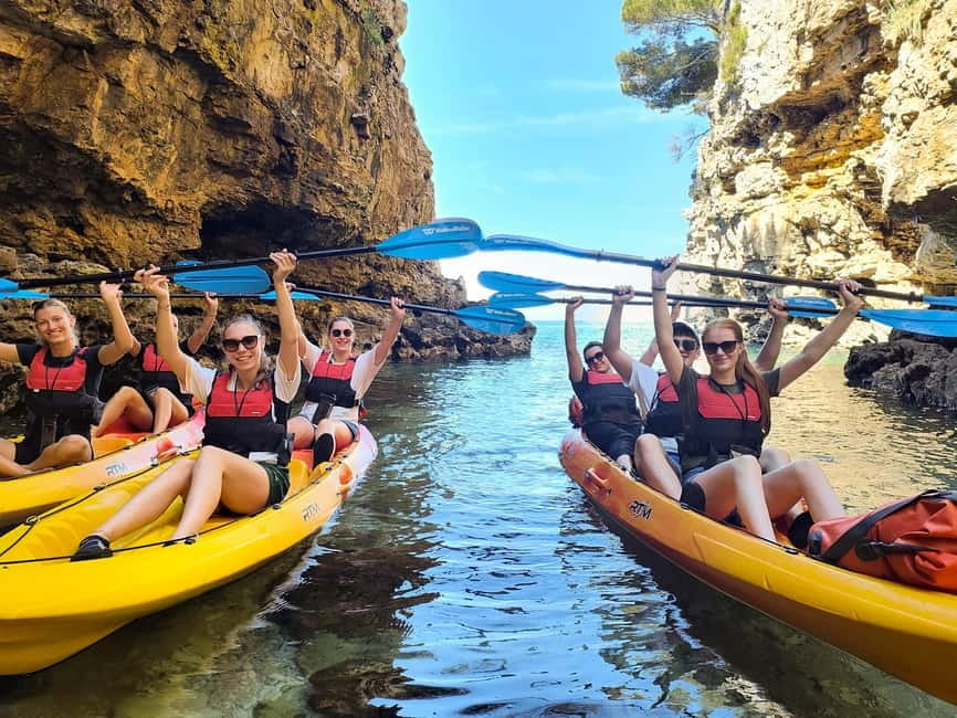 Pula: Cave Kayak Tour, Snorkeling and Island Jumping - Entering the pigeon cave