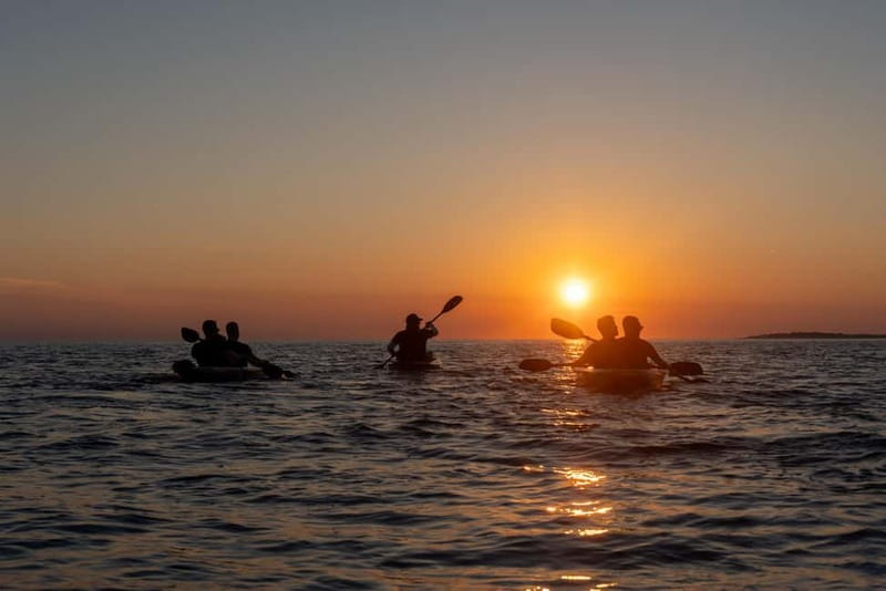 Pula:Sunset Tour By Clear Kayak,Cave,Swim & Cliff Jumping - Paddling a kayak you can see through