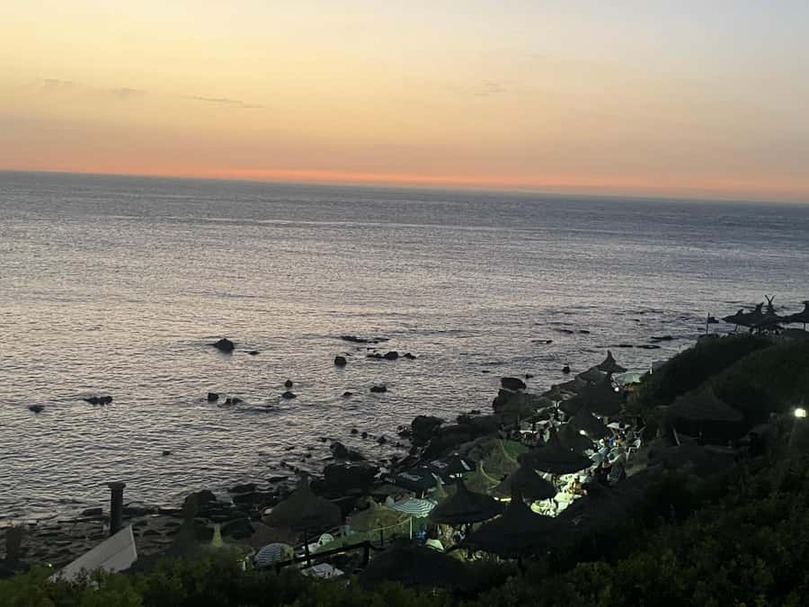 Tangier: Sunset, Tea, Sweets, Camel Ride, and Hercules Caves - From your Tangier accommodation to the western coast