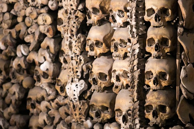 The Original Roman Crypts and Catacombs Tour with Transfers - Walking through the Domitilla Catacombs