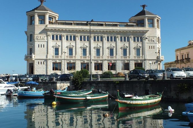 Tour of the island of Ortigia and exploration of sea caves with baths. - The swim stop in clear coastal water