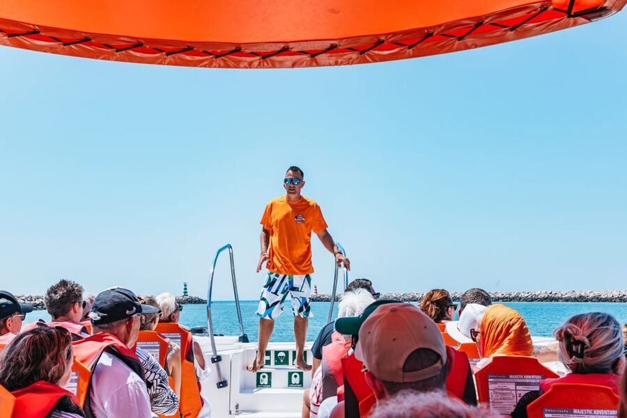 Vilamoura: Benagil Cave Boat Tour with Entry&Dolphin search - Guides, languages, and the feel onboard