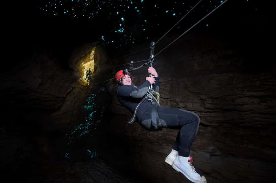 Waitomo Caves Black Abyss Ultimate Caving Experience - Black-water rafting, tight spaces, and waterfalls