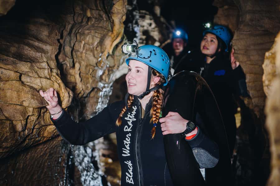 Waitomo Caves: Labyrinth Black Water Rafting Experience - Waterfalls, rock slides, and the cold-water challenge